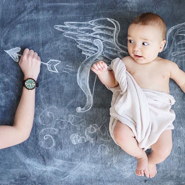 Chalkboard Art. Newborn Photography. Baby Raincoat and rain boots. Creative Monthly Milestone Photo. Chalk Art. Watch Advertisement. Jord Wood Watch.