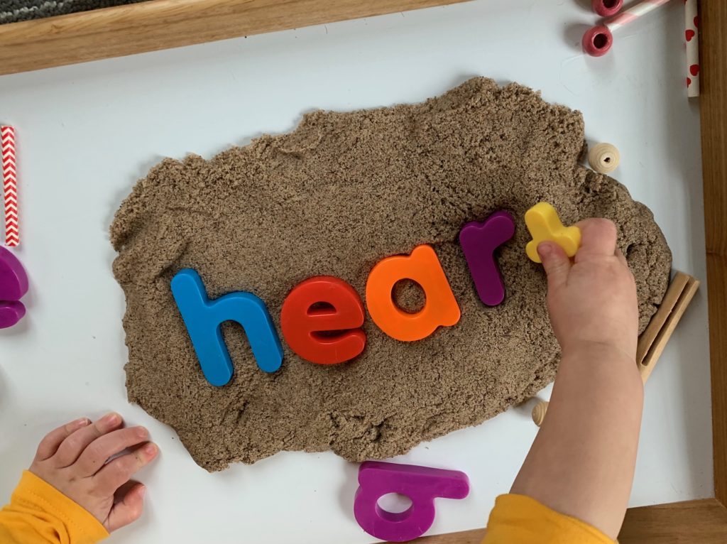 Valentine Sensory Toddler Activity with Kinetic Sand + Pattern Hearts