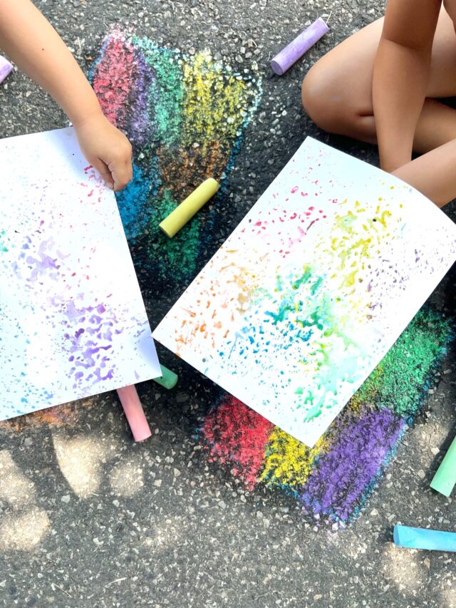 Kids Printmaking with Sidewalk Chalk. Holding colorful Monoprints on paper