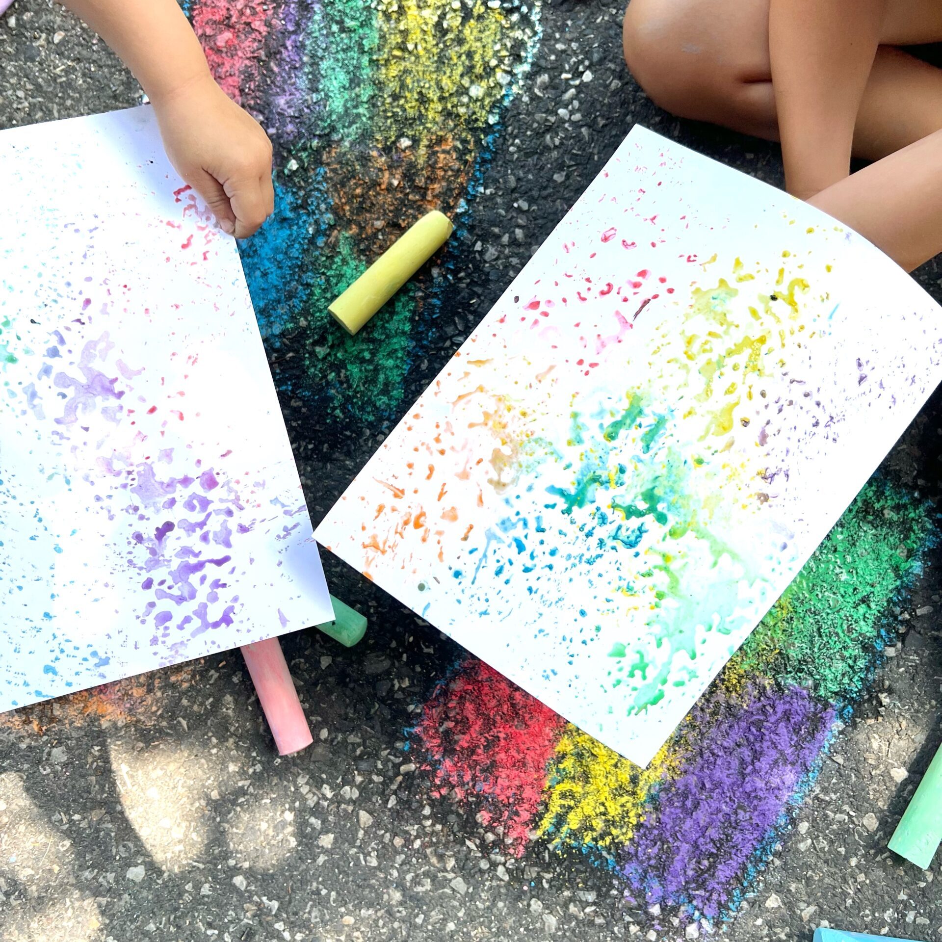 Kids Printmaking with Sidewalk Chalk. Holding colorful Monoprints on paper complete guide to process art for preschoolers
